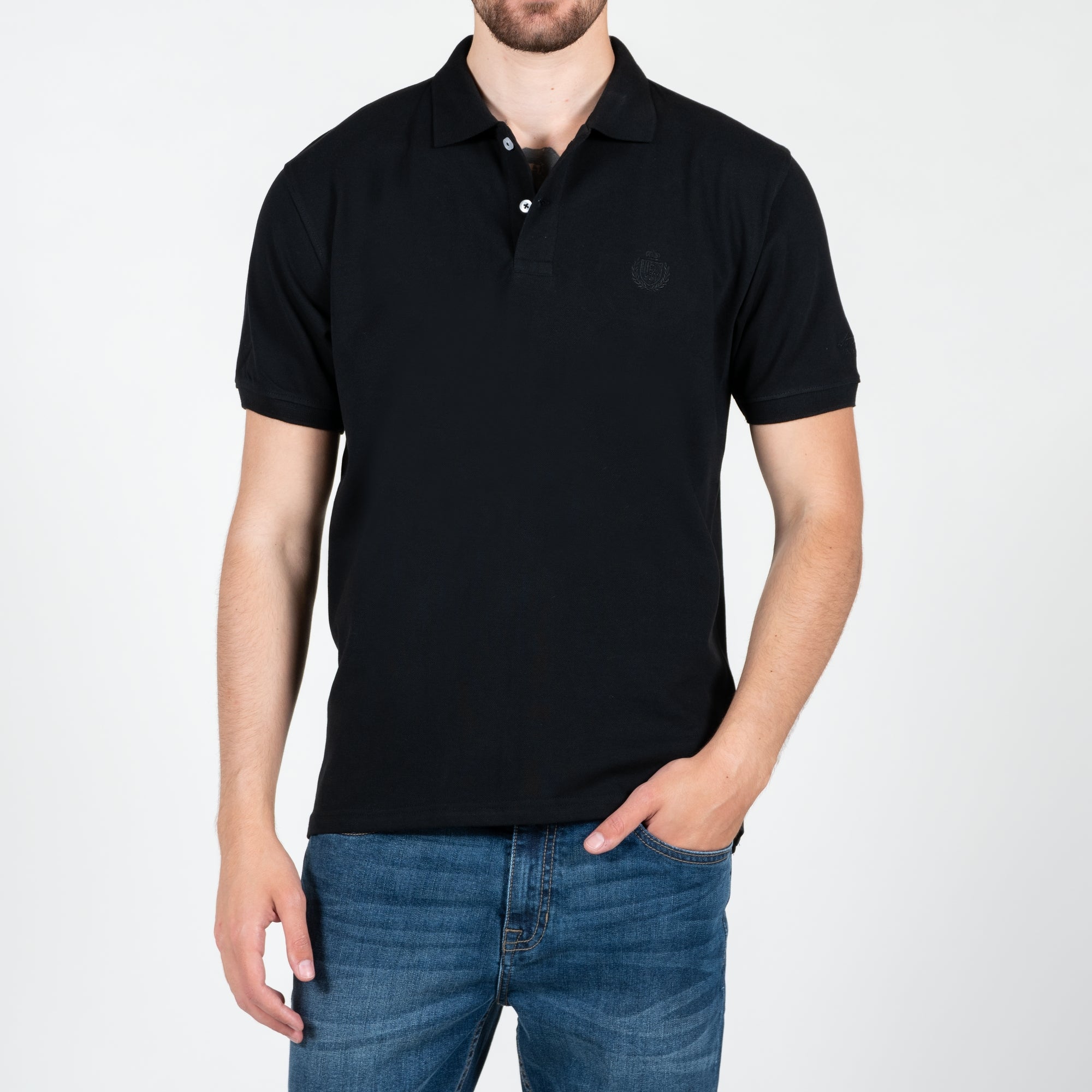 Polo in piquet con logo ricamato tono su tono lato cuore
