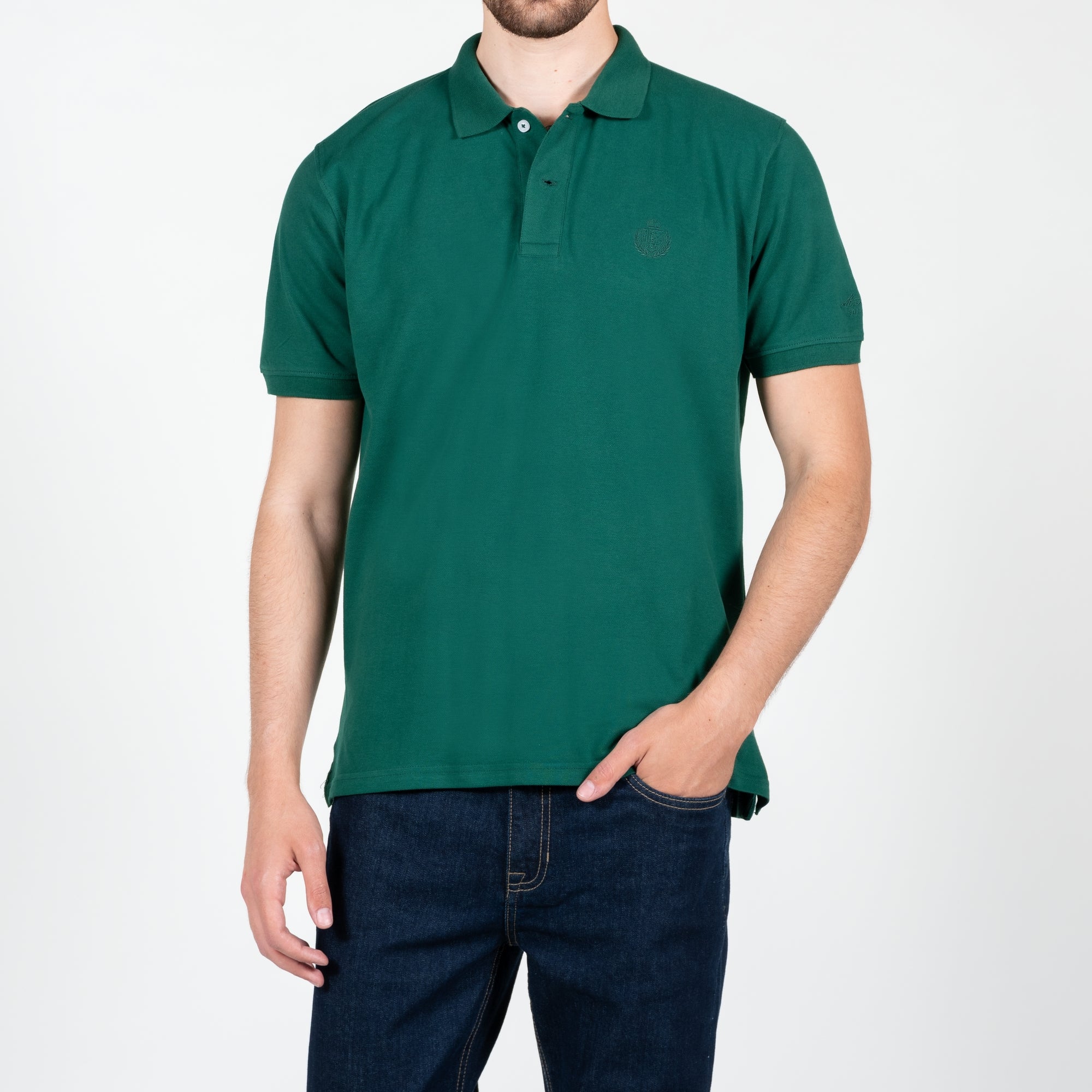 Polo in piquet con logo ricamato tono su tono lato cuore 