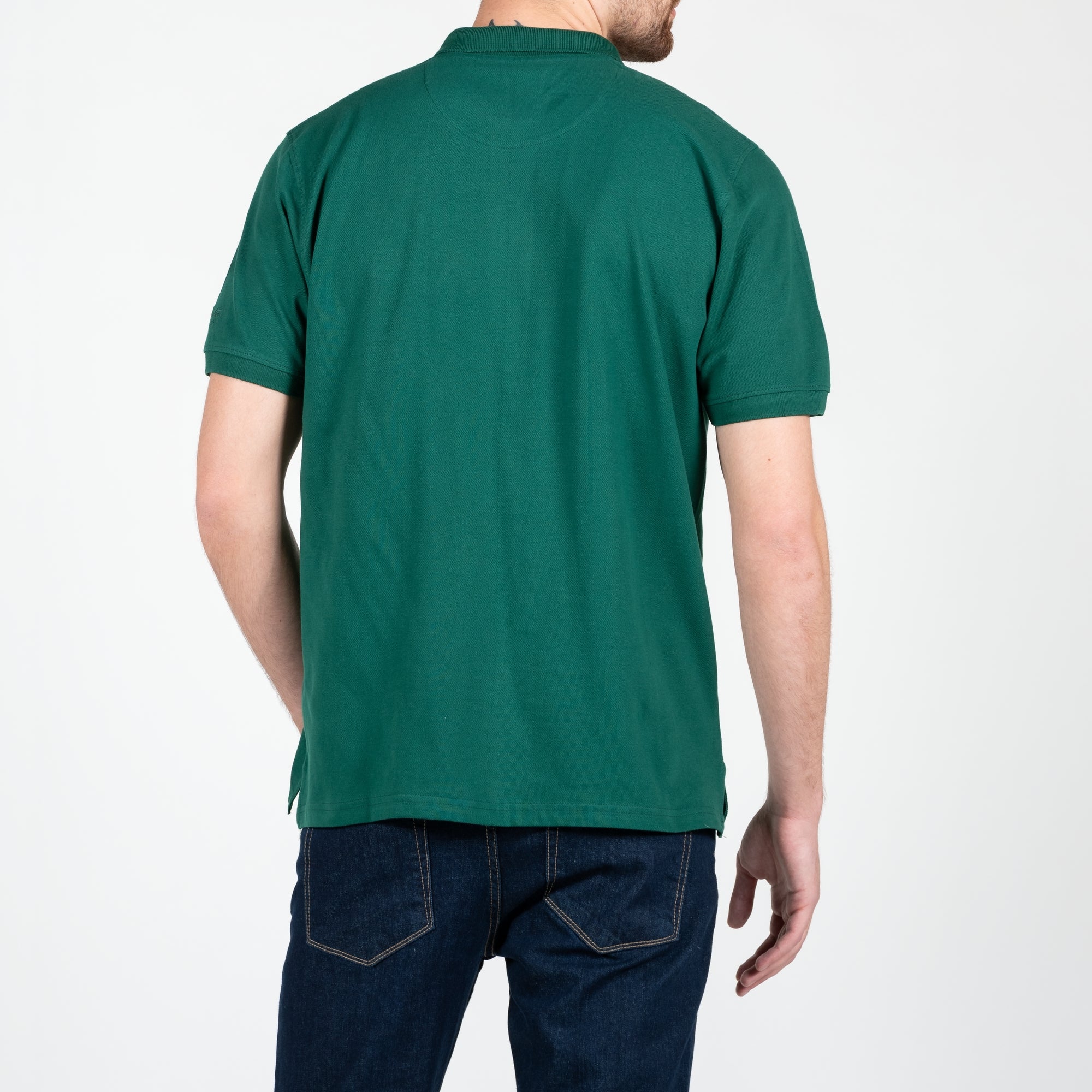 Polo in piquet con logo ricamato tono su tono lato cuore