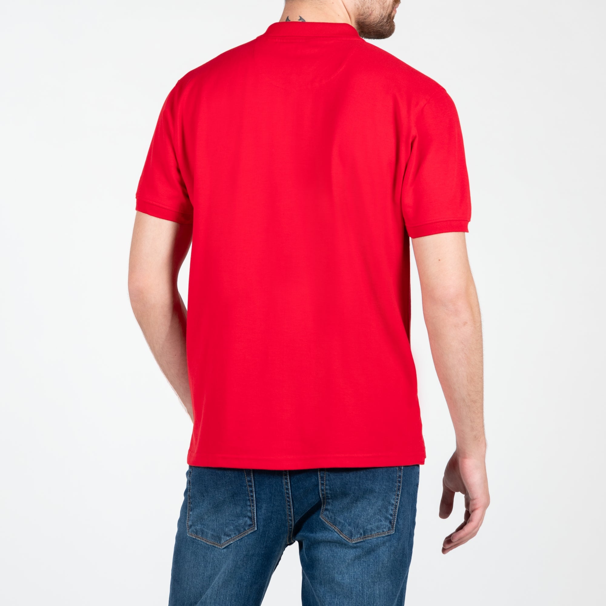 Polo in piquet con logo ricamato tono su tono lato cuore