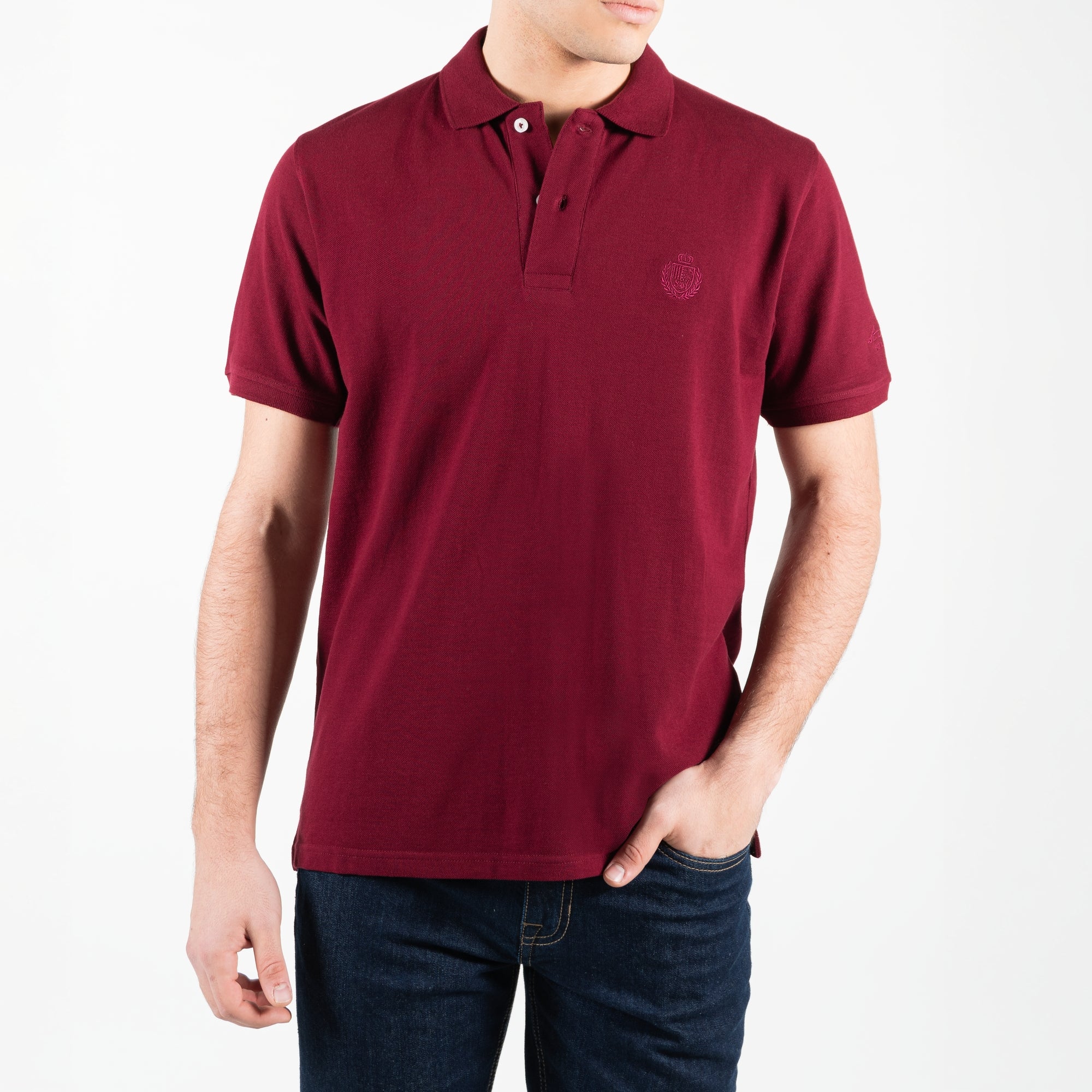 Polo in piquet con logo ricamato tono su tono lato cuore 