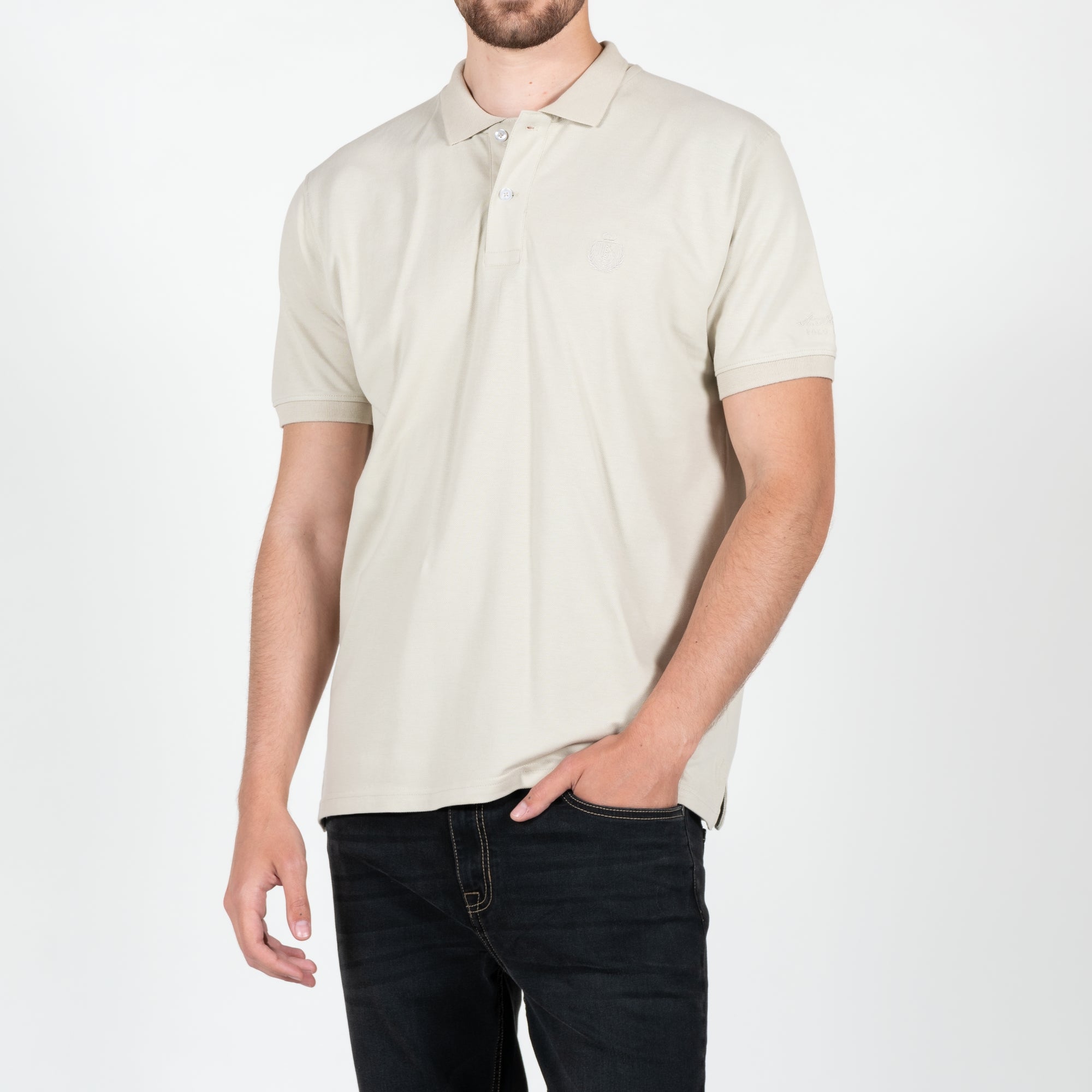 Polo in piquet con logo ricamato tono su tono lato cuore 